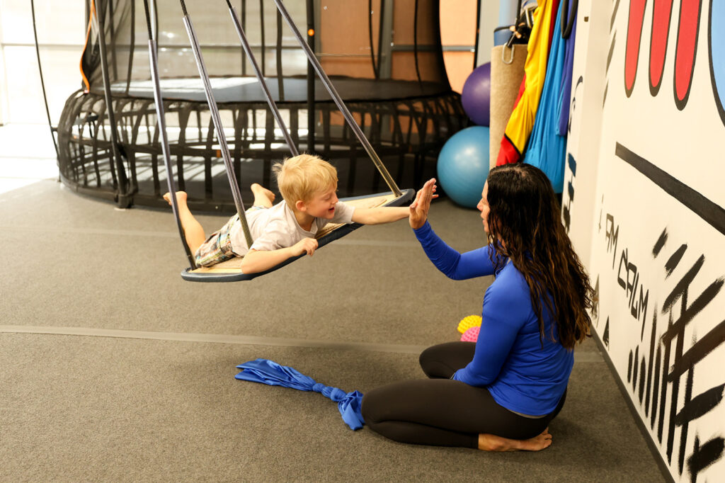 child and therapist doing DIRFloortime play therapy in Sioux Falls
