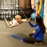 child and therapist doing DIRFloortime play therapy in Sioux Falls