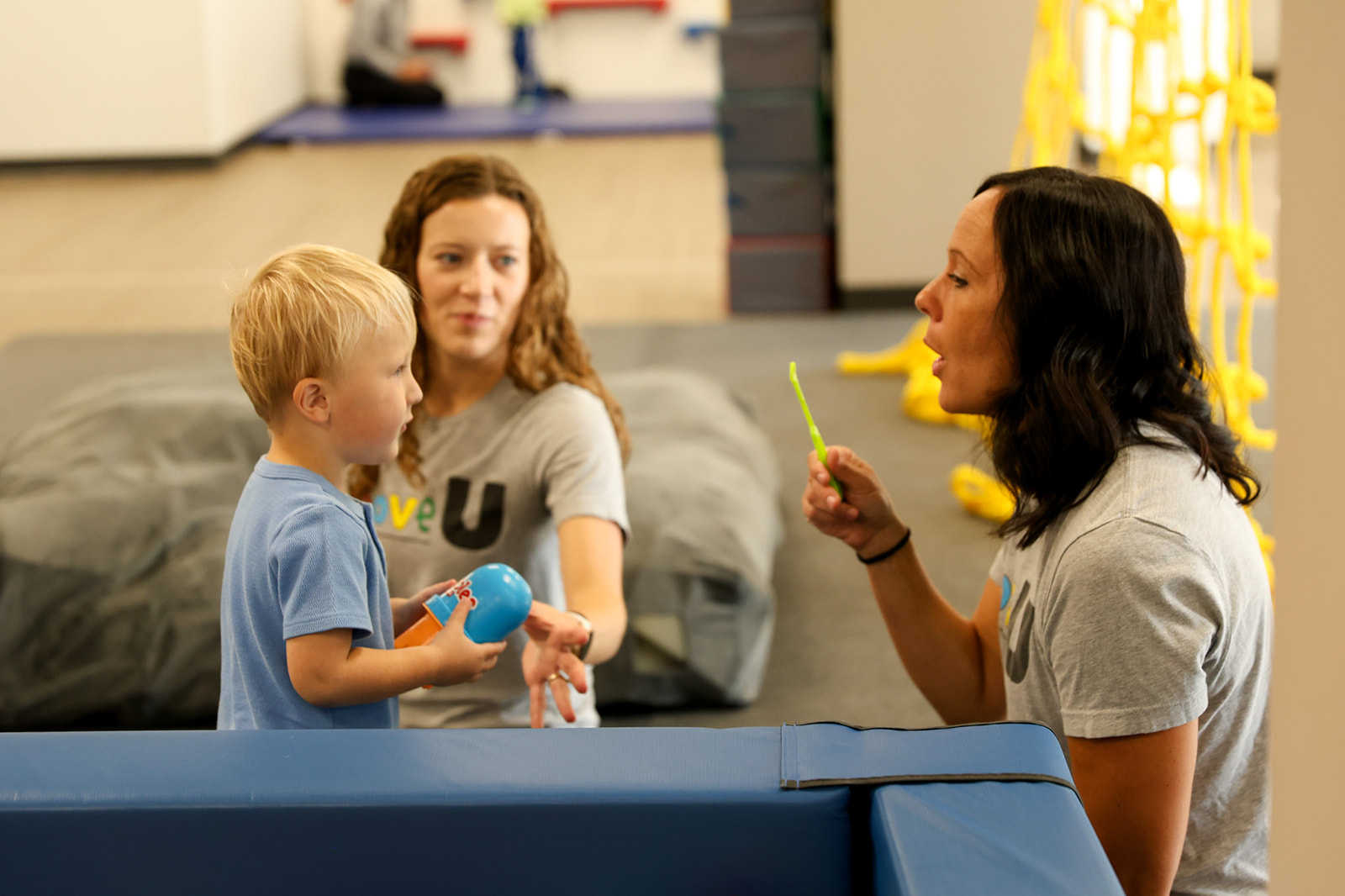 child and therapist doing DIRFloortime play therapy in Sioux Falls"